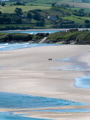 Inchydoney beach at low tide, day. The famous Irish beach on the south coast of the country. Seaside landscape.