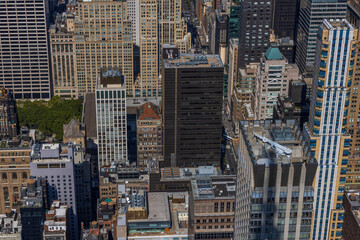 Fototapeta premium Beautiful view from above on roofs of skyscraper buildings. Manhattan, New York, USA.