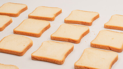Delicious bread slices isolated on a white background, top view.