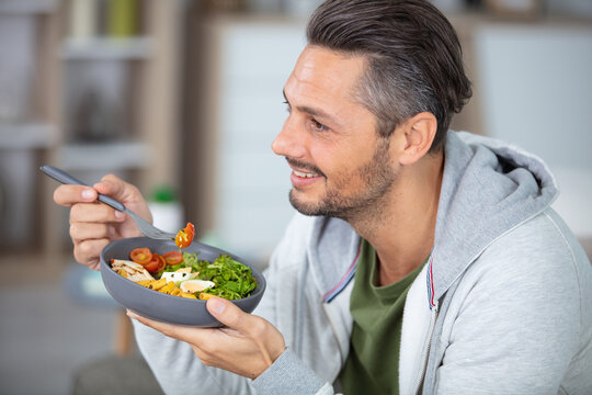 a man eating a healthy meal at home
