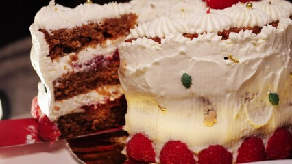A slice of cake with cream cheese and strawberry closeup, homemade cake, dessert in cafe.