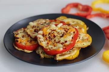Cheesy vegetarian egg ring. Easy and healthy breakfast. Omelet prepared in bell pepper rings with cheese oregano and chili flakes toppings