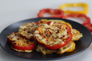 Cheesy vegetarian egg ring. Easy and healthy breakfast. Omelet prepared in bell pepper rings with cheese oregano and chili flakes toppings