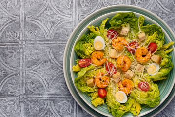 Food photography of caesar salad, prawn, shrimp, romaine, lettuce, quail, egg,  parmesan, croutons, sauce