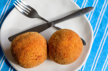 Traditional street food in UK, stuffed fried Scotch eggs with breadcrumbs