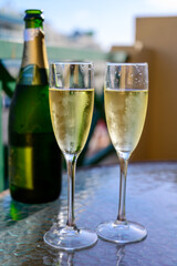 Dinner party, drinking of cava or champagne sparkling wine in vacation resort Caleta Fuste, Fuerteventura, Canary islands vacation, Spain