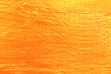 Background or brushed gold metallic surface.