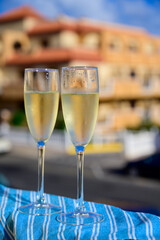 Dinner party, drinking of cava or champagne sparkling wine in vacation resort Caleta Fuste, Fuerteventura, Canary islands vacation, Spain