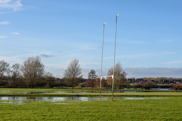 Flooded sports pitch after heavy rain the field is waterlogged