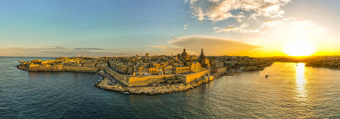Fototapeta na wymiar Valletta, Malta aerial panoramic view of old town at sunset