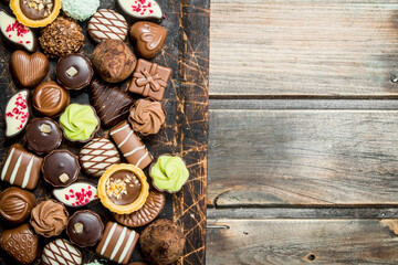 Chocolate sweets on a wooden Board.