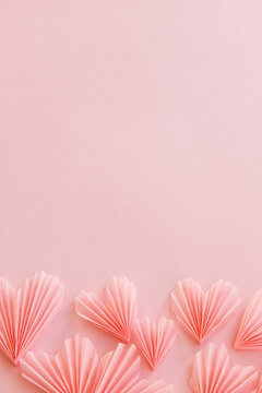 Happy Valentine's day! Stylish pink hearts flat lay on pink paper background. Modern cute valentine hearts card with space for text. Creative love banner