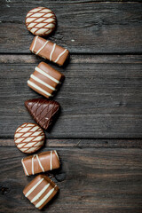 Chocolate sweets with nuts and various fillings.