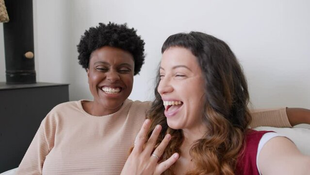 POV Of Black Woman And Partner With Mobile Phone Announcing Engagement On Video Call In The Sofa