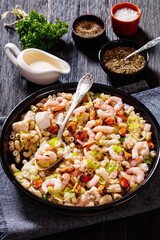 macaroni salad with shrimps, mussels, fish, leek