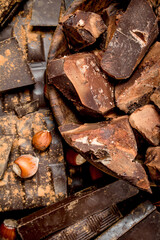 Assortment of different chocolate with nuts and cinnamon.