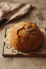 A loaf of rye bread in low key