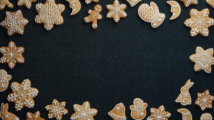 Obraz na płótnie Canvas Christmas gingerbread frame on a black background and place for text in the center. Christmas Concept. Creative Background. Copy Space