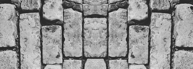 Retro Vintage Weathered Distressed Brick wall with Damaged Surface. Symmetrical Wide Web  Banner Backdrop background. Black and white Pattern. Panoramic Format