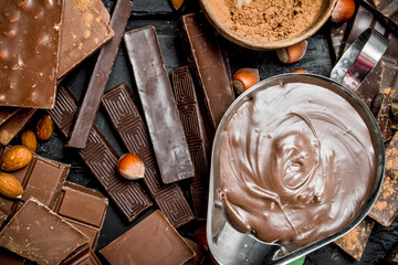 Chocolate background. Various assortment of chocolate with paste.