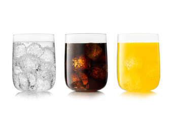 Three large glasses with cola soft drink with orange soda and lemonade with ice cubes on white.