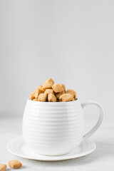 Nigerian Chin chin in a ceramic cup, Fried chin-chin snack in a cup, Nigerian party food and small chops	