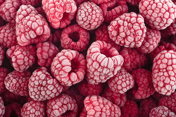 Frozen raspberries covered with hoarfrost, top view. Berries background. Summer berries.