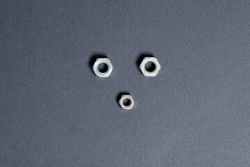Top view of screws isolated on black paper background