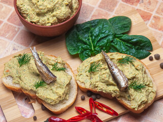 Sandwich with fish pate and sprats.