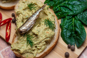 Sandwich with fish pate and sprats.