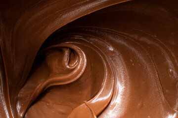 melted chocolate pouring and stirring