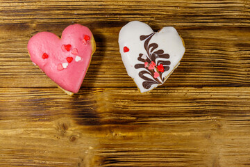 Heart shaped cookies on wooden table. Top view, copy space. Dessert for valentine day
