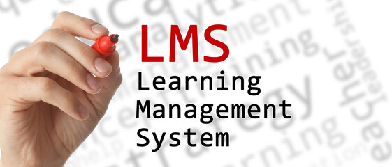 Learning management system. Woman writing abbreviation LMS on glass board, closeup. White...