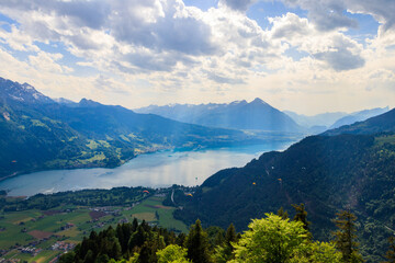 Fototapeta premium Breathtaking aerial view of Lake Thun and Swiss Alps from Harder Kulm viewpoint, Switzerland