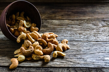Cashew nuts roasted in a ceramic bowl.