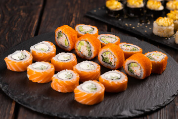 Rolls set with fish shrimp and caviar sushi with chopsticks - asian food and japanese cuisine concept
