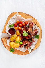 grilled ribs with baked  potatoes