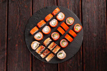 Rolls set with fish shrimp and caviar sushi with chopsticks - asian food and japanese cuisine concept