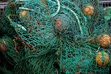 A close up of a pile of fishing nets and ropes