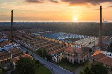 Aerial view of historic worker village of Crespi d'Adda during sunset, Lombardy, Italy