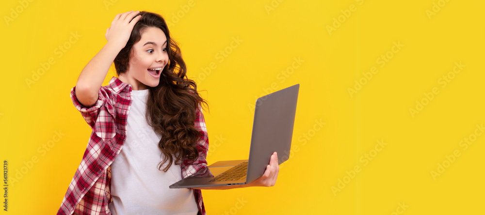 Wall mural surprised teen girl use laptop for blogging. webinar at online education. school girl portrait with 