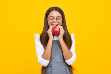 Portrait of confident teen girl with apple going to have healthy snack. Health, nutrition, dieting and kids vitamins.