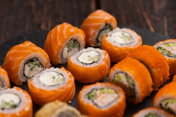 Rolls set with fish shrimp and caviar sushi with chopsticks - asian food and japanese cuisine concept