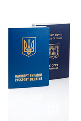 Israeli and Ukrainian foreign passports isolated on white background. Close-up.