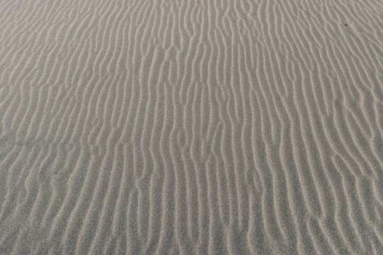 Textura De Arena Fina De Playa Con Surcos En Un Atardecer