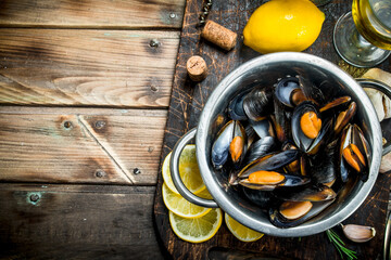 Fresh seafood clams in a pot of white wine. - 561926518
