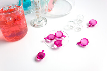 Serum capsules for healthy skin. Skin care and supplements for clear and radiant skin. Equipment and science experiments in the laboratory.