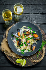 Mediterranean food. Seafood spaghetti with clams and white wine.