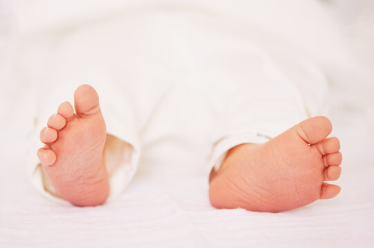 Close up image of tiny newborn baby feet