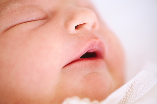Close up image of newborn baby face